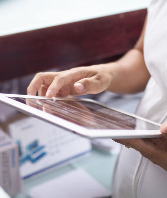 Nurse looking at a tablet Nurse looking at a tablet